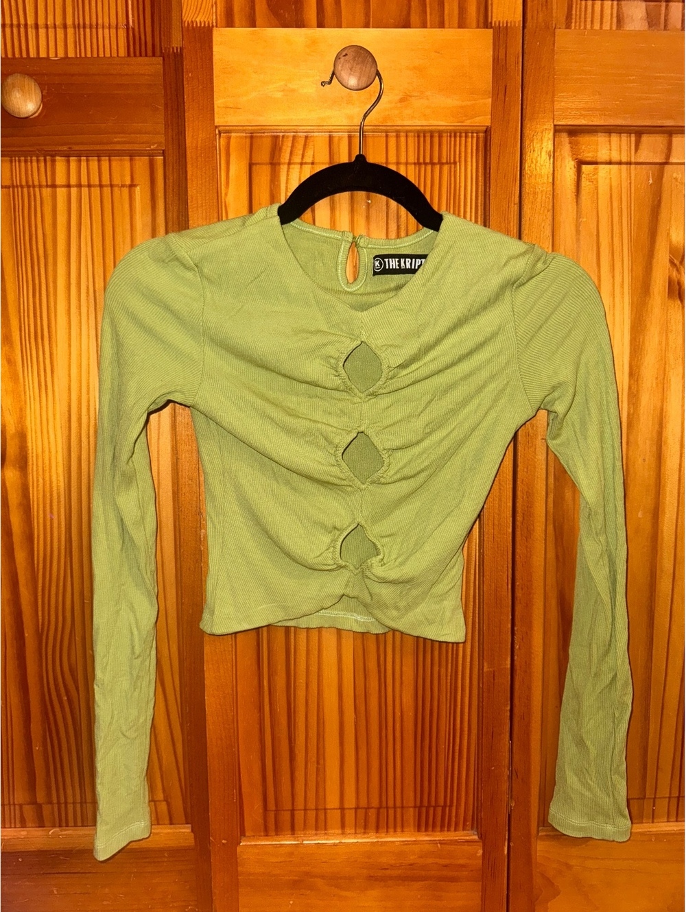 The Kript sage green cutout long sleeve top